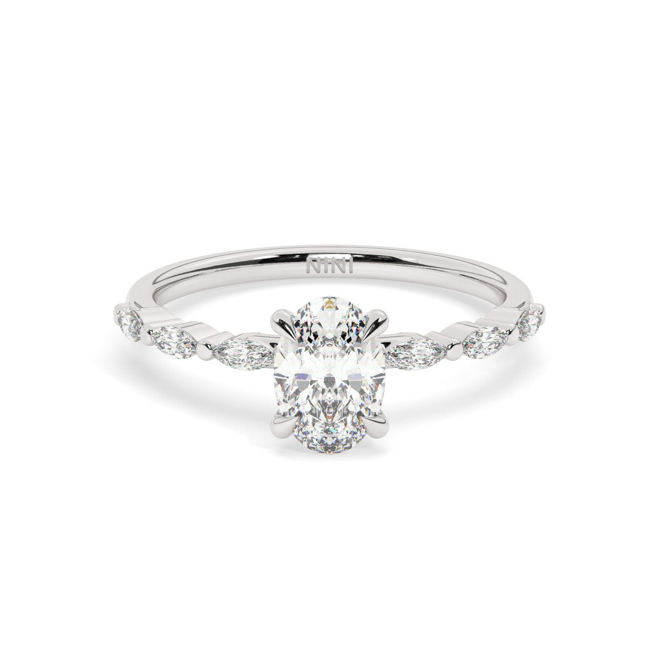Oval cut diamond engagement ring, The band is set with Marquise cut diamonds.
14K gold.