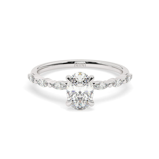 Oval cut diamond engagement ring, The band is set with Marquise cut diamonds.
14K gold.