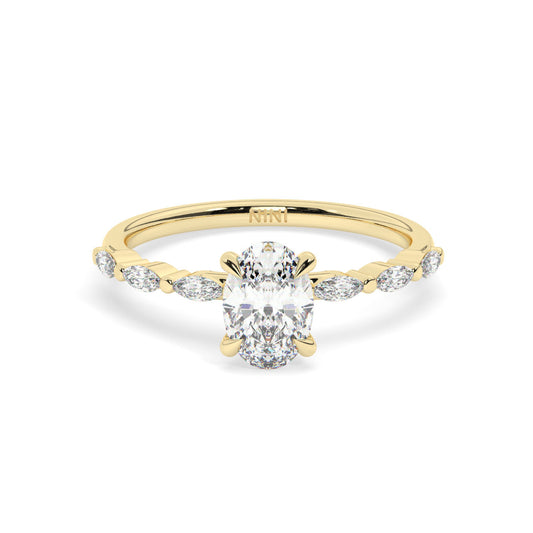 Oval cut diamond engagement ring, The band is set with Marquise cut diamonds.
14K gold.