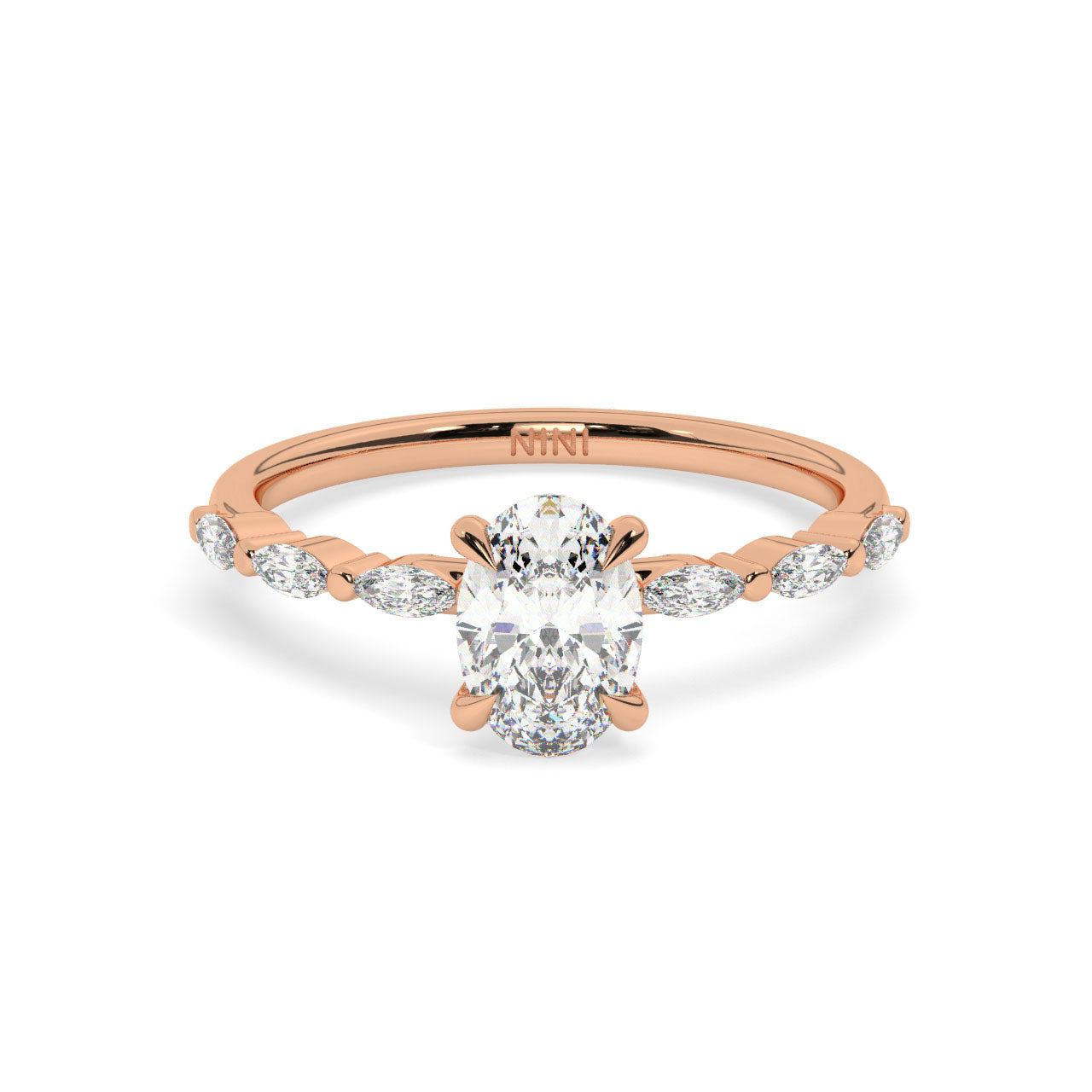 Oval cut diamond engagement ring, The band is set with Marquise cut diamonds.
14K gold.